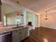 Open kitchen with granite countertops overlooking the living area at 851 Millvale Pl, Lawrenceville, GA 30044