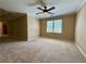 Comfortable main bedroom with a ceiling fan and large windows providing natural light at 851 Millvale Pl, Lawrenceville, GA 30044