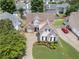 Aerial view of a charming two-story home with stone accents and a well-manicured lawn at 1472 Lynchburg Pl, Marietta, GA 30062