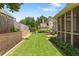 Beautiful backyard featuring lush green grass, a screened porch, and a stone patio, great for outdoor enjoyment at 1472 Lynchburg Pl, Marietta, GA 30062