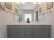 This bathroom features a large double vanity, a large mirror and modern fixtures at 1472 Lynchburg Pl, Marietta, GA 30062