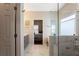 Bright bathroom showcases a glass-enclosed shower and a view into the primary bedroom at 1472 Lynchburg Pl, Marietta, GA 30062