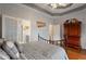 Spacious bedroom boasts hardwood floors and a charming tray ceiling with recessed lighting at 1472 Lynchburg Pl, Marietta, GA 30062