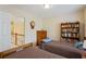 Bedroom showing a bookshelf and access to the upstairs hallway from the room at 1472 Lynchburg Pl, Marietta, GA 30062
