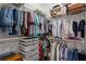 Well-organized walk-in closet offers ample storage with shelves, hanging rods, and drawer organizers at 1472 Lynchburg Pl, Marietta, GA 30062