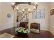 Dining room with decorative chandelier with hardwood floors and a nearby staircase at 1472 Lynchburg Pl, Marietta, GA 30062