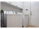 Bright laundry room with modern washer and dryer units and ample storage cabinets at 1472 Lynchburg Pl, Marietta, GA 30062