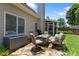 Inviting patio with comfortable seating, fire pit, and view of the screened-in porch, ideal for outdoor relaxation at 1472 Lynchburg Pl, Marietta, GA 30062