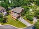 An aerial view of a traditional home showcasing its well-manicured lawn, mature trees, and overall curb appeal at 1701 Clay Brooke Se Ct, Smyrna, GA 30082