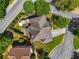Aerial view of a home with a well-manicured lawn, a deck with umbrellas, and a driveway leading to the street at 1701 Clay Brooke Se Ct, Smyrna, GA 30082