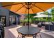 Outdoor deck with a dining table, chairs, an umbrella, and outdoor seating at 1701 Clay Brooke Se Ct, Smyrna, GA 30082