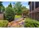 A lush backyard with a water feature and deck offers a serene outdoor living space at 1701 Clay Brooke Se Ct, Smyrna, GA 30082