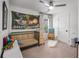 Bright bedroom featuring a ceiling fan, neutral carpet and a bed with a Happy Birthday themed tapestry at 1701 Clay Brooke Se Ct, Smyrna, GA 30082