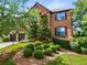 Traditional brick home featuring black shutters, an attached two-car garage, and manicured landscaping at 1701 Clay Brooke Se Ct, Smyrna, GA 30082