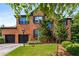 Charming brick home featuring a two-car garage, manicured lawn, and beautiful landscaping at 1701 Clay Brooke Se Ct, Smyrna, GA 30082