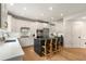 Modern kitchen featuring white cabinets, quartz countertops, stainless steel appliances, and a breakfast bar at 1701 Clay Brooke Se Ct, Smyrna, GA 30082
