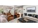 Cozy living room with hardwood floors, a modern sofa, and two armchairs at 1701 Clay Brooke Se Ct, Smyrna, GA 30082