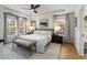 Bright main bedroom featuring tray ceiling, large windows, and an adjoining en suite at 1701 Clay Brooke Se Ct, Smyrna, GA 30082