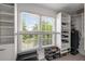 Bright walk-in closet with organized shelving, drawers, and a large window for natural light at 1701 Clay Brooke Se Ct, Smyrna, GA 30082