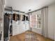 Custom walk-in closet with ample storage, built-in shelving, and natural light from a window at 1701 Clay Brooke Se Ct, Smyrna, GA 30082