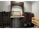 A home wine cellar with decorative rack, lighted counter and wood accents is perfect for enjoying a glass of wine at 1701 Clay Brooke Se Ct, Smyrna, GA 30082