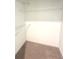 This closet features standard shelves and carpet flooring at 3106 Zodiac Ct, Lawrenceville, GA 30044