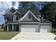 Beautiful two-story home features a gray exterior, white trim and a two car garage at 3106 Zodiac Ct, Lawrenceville, GA 30044