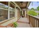 Relaxing balcony with woven rug, screened partition, and pleasant outdoor view at 3202 Saute Way, Avondale Estates, GA 30002