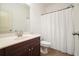 Cozy bathroom with single sink vanity, neutral colors, and a shower with curtain at 3202 Saute Way, Avondale Estates, GA 30002