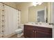 Bathroom featuring a vanity with sink, toilet, and tub with a decorative shower curtain at 3202 Saute Way, Avondale Estates, GA 30002