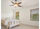 Bright bedroom features two windows, neutral colors, carpet floors, and a ceiling fan at 3202 Saute Way, Avondale Estates, GA 30002