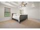 Spacious bedroom with tray ceiling, ceiling fan, and large windows at 3202 Saute Way, Avondale Estates, GA 30002