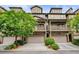 Charming townhome with brick accents, garage, and a balcony overlooking a landscaped yard at 3202 Saute Way, Avondale Estates, GA 30002