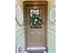 Inviting brown front door with decorative wreath and stylish decorative accents at 3202 Saute Way, Avondale Estates, GA 30002