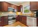 Well-appointed kitchen with stainless steel appliances, granite countertops, and classic cabinetry at 3202 Saute Way, Avondale Estates, GA 30002