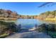 Scenic lake view surrounded by trees and landscaping; stairway access to the water at 3202 Saute Way, Avondale Estates, GA 30002