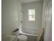 Bathroom showing tub, toilet, and sink. Ready for finishing details at 451 Collier Ridge Nw Dr, Atlanta, GA 30318