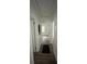 Hallway with new flooring, white walls, and white trim, provides access to other rooms at 451 Collier Ridge Nw Dr, Atlanta, GA 30318