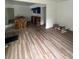 Open-concept living area features beautiful new wood-look floors throughout the home at 451 Collier Ridge Nw Dr, Atlanta, GA 30318