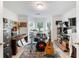 Spacious bonus room featuring a drum set, recording equipment, desk and large bay window at 733 Exchange Mill Pl, Dacula, GA 30019