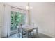 Light filled dining area featuring large windows and natural light at 733 Exchange Mill Pl, Dacula, GA 30019