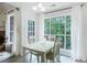 Light filled dining area featuring large windows and natural light at 733 Exchange Mill Pl, Dacula, GA 30019