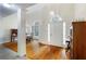 Spacious foyer with hardwood floors and decorative lighting at 733 Exchange Mill Pl, Dacula, GA 30019
