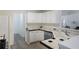 Bright kitchen with white cabinets, and tile countertops at 733 Exchange Mill Pl, Dacula, GA 30019