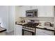 Close up of kitchen stove and countertop at 733 Exchange Mill Pl, Dacula, GA 30019