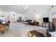 Open living room with fireplace, neutral carpet, and ample natural light at 733 Exchange Mill Pl, Dacula, GA 30019