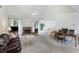 Bright living room with fireplace, neutral carpet, and vaulted ceiling at 733 Exchange Mill Pl, Dacula, GA 30019