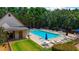 Community pool with lounge chairs and umbrellas provides a refreshing oasis for residents at 733 Exchange Mill Pl, Dacula, GA 30019