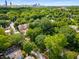 A stunning aerial view showcasing a neighborhood setting, mature trees, and proximity to city at 1200 Mansfield Ne Ave, Atlanta, GA 30307