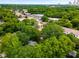 A beautiful aerial view showcasing the neighborhood, mature trees, and proximity to commercial spaces at 1200 Mansfield Ne Ave, Atlanta, GA 30307